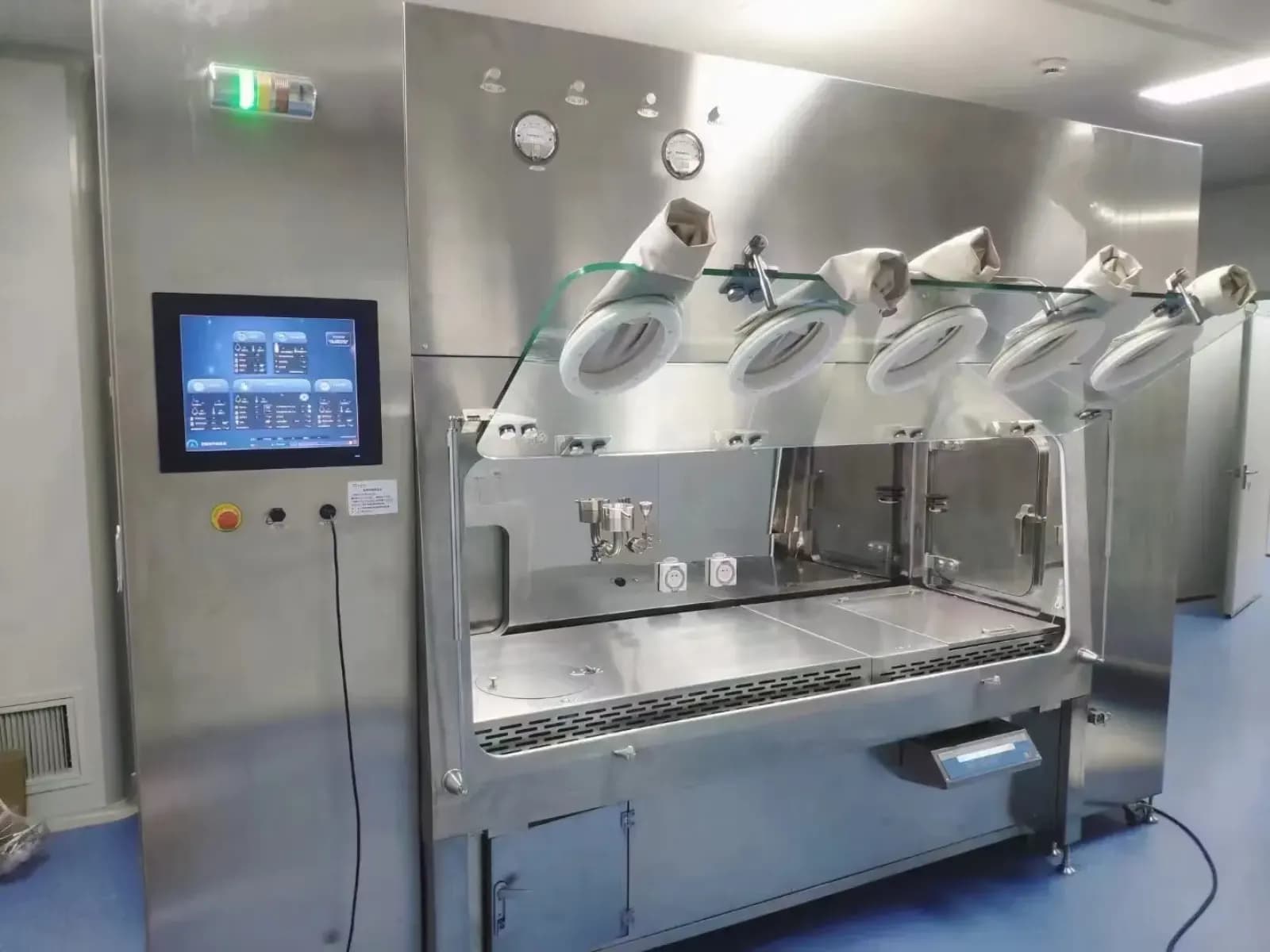 Sterile test isolator with glove ports and integrated controls